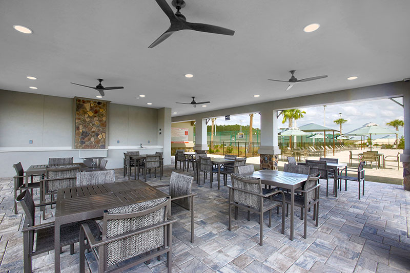 The pool patio area at The Landing in On Top of the World Communities Active Adults