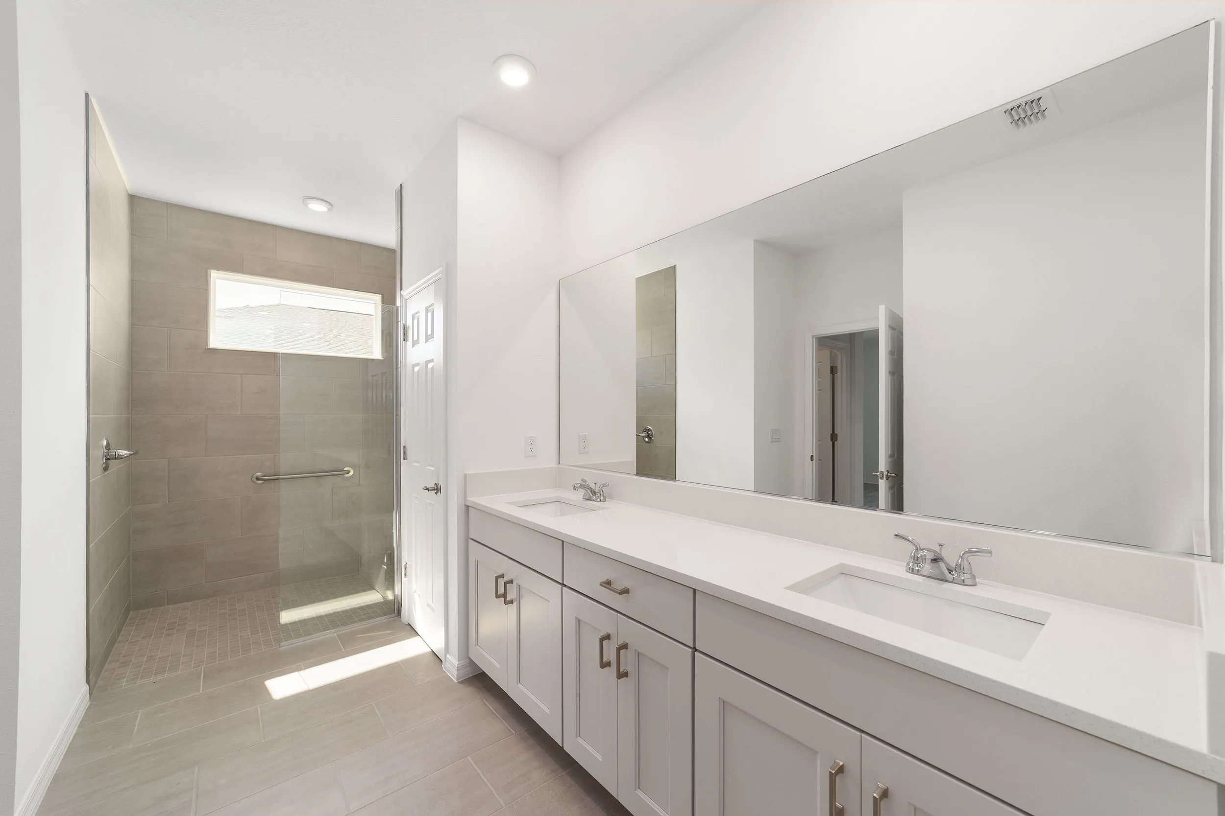 MIR_10339-SW-105th-Terrace_Lot144_bathroom spacious modern bathroom with lots of space and his and hers sinks in a 3 bedroom house for sale in Ocala FL