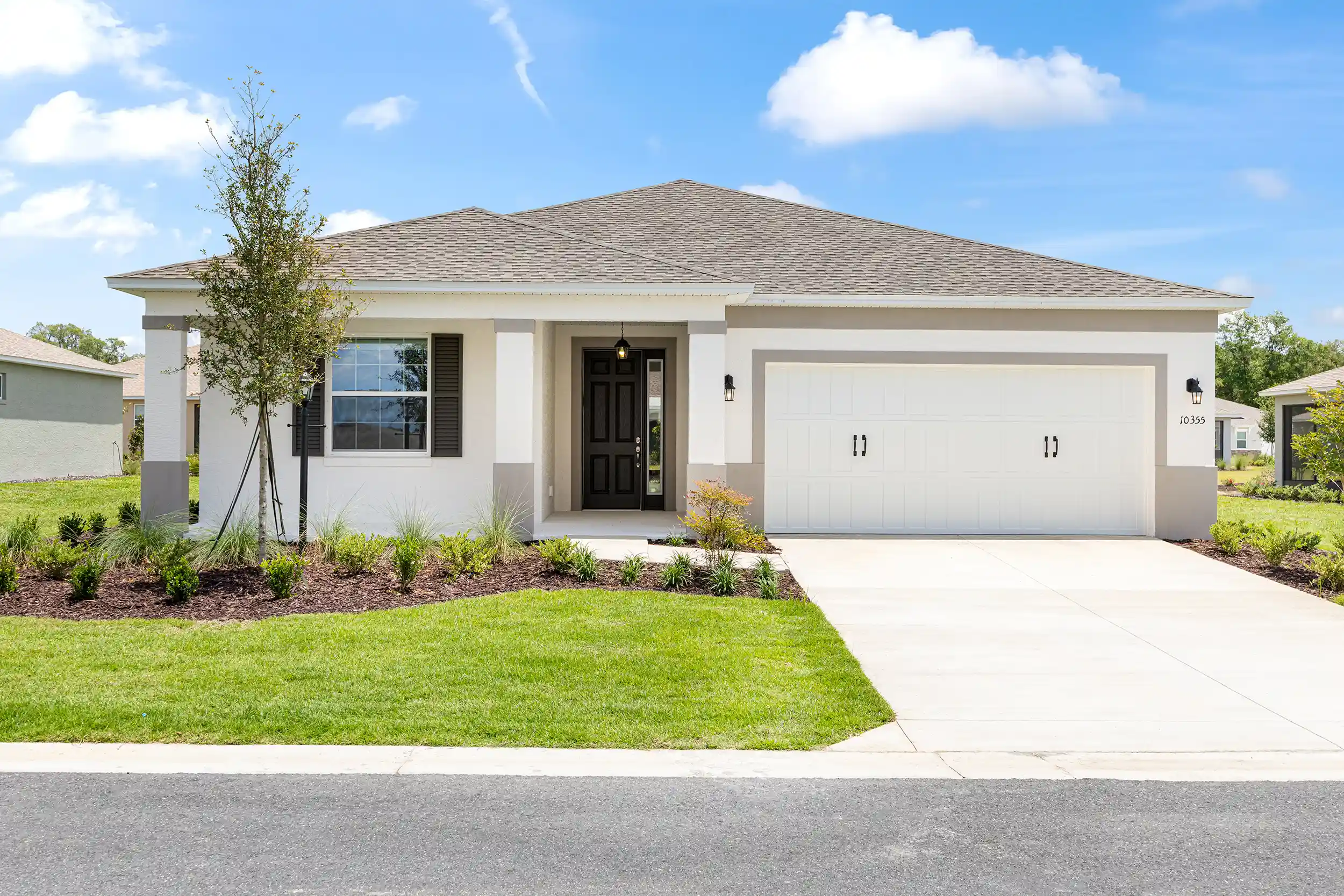 MIR_10355-SW-105th- Terrace-Ocala-lot-145-front-exterior new construction large open floor plan home for sale in Ocala FL in amazing community to retire, one level home with 2 car garage